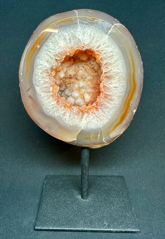 Natural Agate Geode on a metal stand. 16 cm tall.